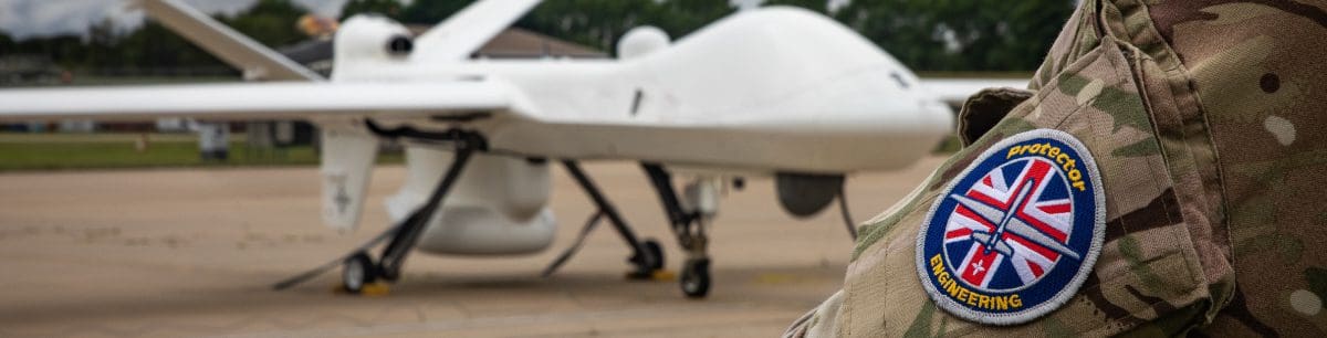 An army person's badge with a drone in the background