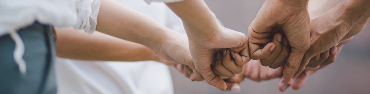 Group of hands in a circle