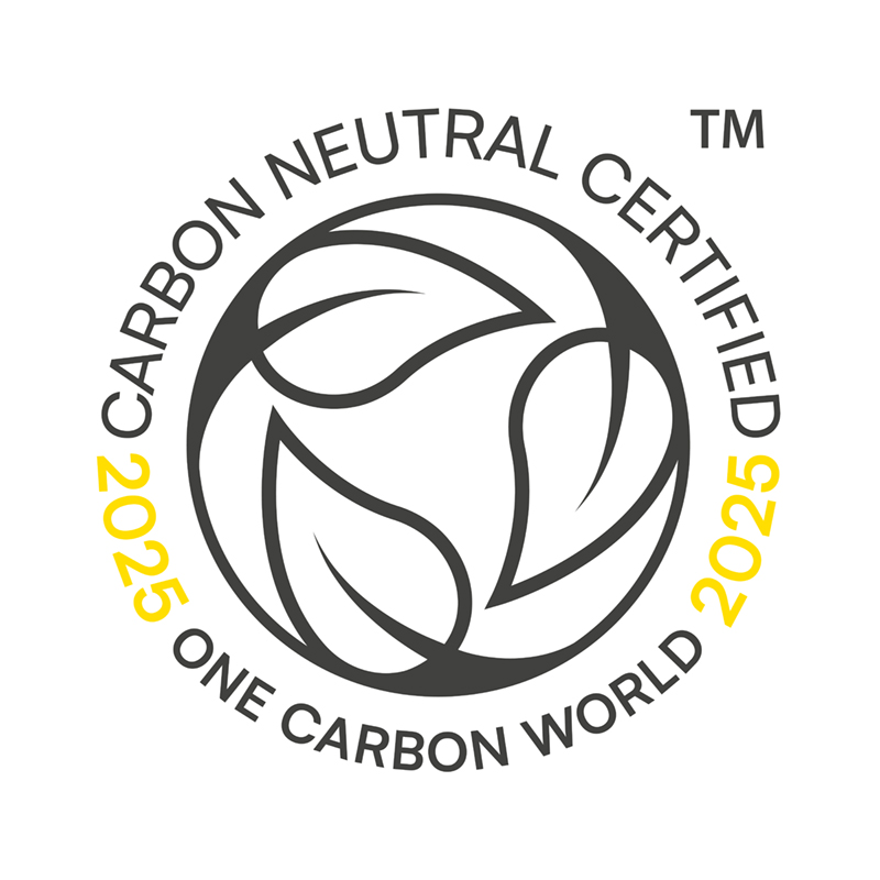 Badge reading Carbon Neutral Certified 2025 One Carbon World with circular leaf design.